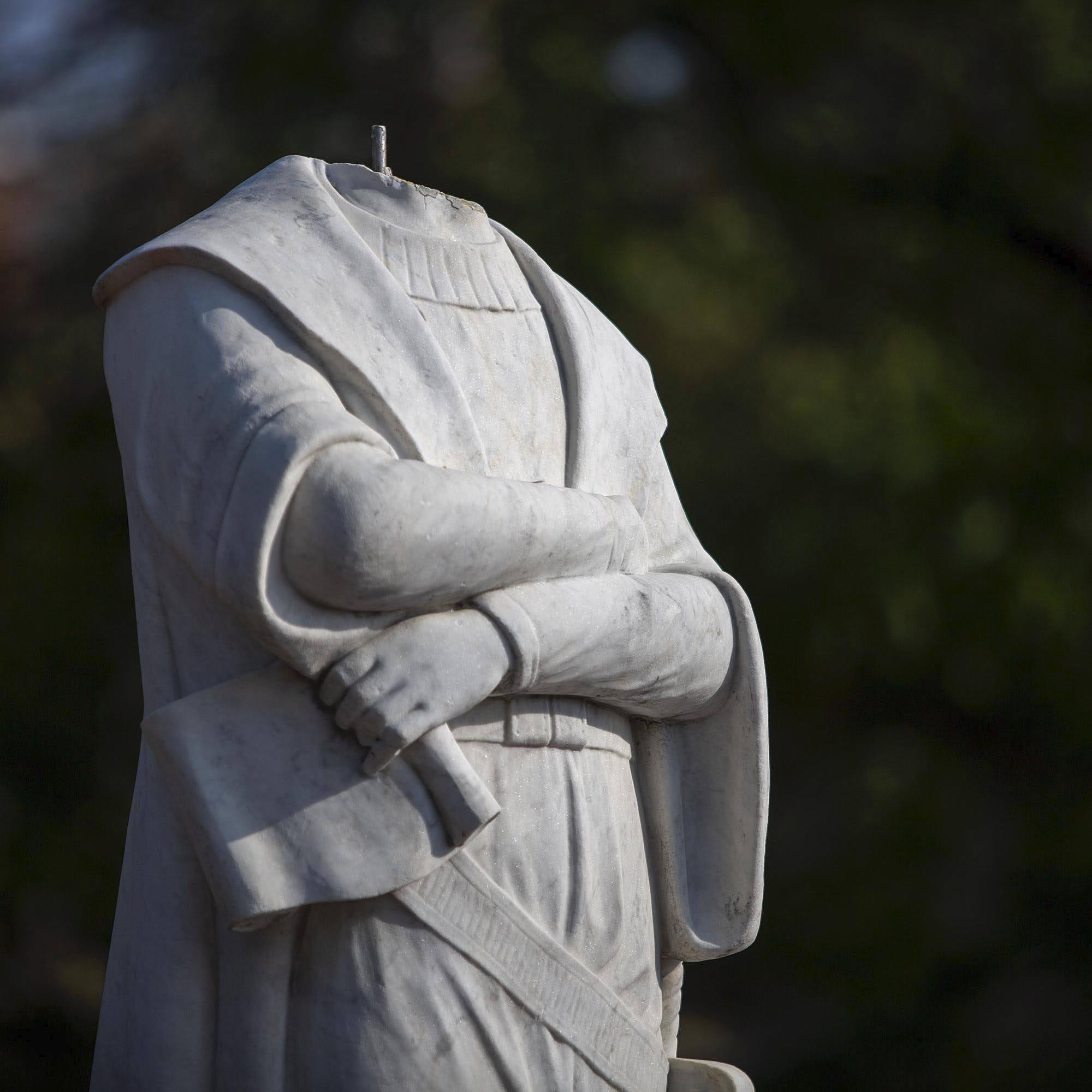 The now headless statue of Christopher Columbus in Columbus Waterfront Park in Boston. (Robin Lubbock/WBUR)