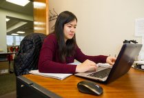 Rosy Chen (ENG’17) using a laptop