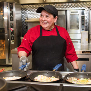 Omelette maker Cecelia Lopez works her magic at The Warren Towers dinging hall January 23, 2018