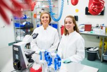 PhD Candidate Whitney Manhart and Research Technician Jennifer Pacheco pose for a photo at the Boston University National Emerging Infectious Diseases Laboratories (NEIDL). They are working with Dr. Elke Muhlberger on LLOV, a filovirus related to Ebola.
