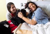Cara Guenther and Otis visit Darinta Larios in BMC's Pediatric Inpatient Unit