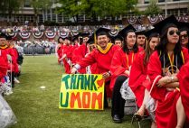 A graduate of the Boston University Class of 2019 celebrates after graduating at the 146th All University Commencement.