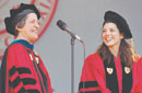 Suzanne Cutler, a BU trustee and executive vice president of the Federal Reserve Bank of New York, escorts Marisa Tomei to the podium to receive an honorary degree. Photo by Kalman Zabarsky