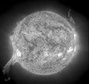 An “eruptive prominence” (lower left corner) on the sun showed up in a picture taken by the Solar and Heliospheric Observatory (SOHO) satellite on July 1, 2002. It wasn’t headed for earth, but when similar eruptions are aimed toward our planet, they can create space weather that causes a significant amount of aurora and other geomagnetic activity. Photo courtesy of NASA/ESA