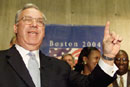 Boston Mayor Thomas Menino (Hon.’01), shown here celebrating the November 13 announcement that Boston will host the 2004 Democratic National Convention, will reflect well on the city during the convention because he comes across “as a real person,” says CGS Assistant Professor Thomas J. Whalen. Moreover, Whalen says, the convention could remake the city’s reputation nationally by showing that it has outgrown its past of political corruption and racial tension. Photo by Reuters/Jim Bourg