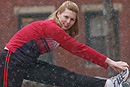 Rebecca Ryan stretches in snow flurries. Photo by Vernon Doucette 
