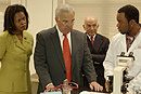 Following an August 17 press conference at CityLab Academy, recent program graduate James Leonard (right), who now works as a technician at Genzyme in Cambridge, with (left to right) State Senator Diane Wilkerson (D-Boston), Boston Mayor Thomas Menino (Hon.01), and BU President ad interim Aram Chobanian. Photo by Kalman Zabarsky