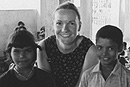 Carolyn Norris (SED07), director of the Student Activities Office, with two friends at the Dazzling Stone Home for Children near Chennai, India. Photo courtesy of Carolyn Norris