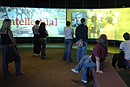 Prospective students take a tour of the Experience Room, whose multimedia presentations provide a detailed look at BU life. Photo by Kalman Zabarsky