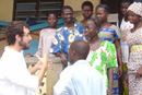 BUs efforts in global health run the gamut; they include the SPH Masters International Program, which allows students to earn up to five credits during 27 months of service in the Peace Corps. Kevin Fiori (SPH03) (left), stationed in Kara, Togo, talks with members of the Association Espoir Pour Demain (Hope for Tomorrow), which provides comprehensive HIV/AIDS services at the community level. Photo by Anna Summa