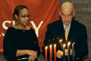 President ad interim Aram Chobanian and Zania Saul (SED05) at a December 2 ceremony celebrating Kwanza.