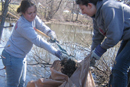 Rebecca Lavery (COM05) (left) and April Wildermuth (COM05) help clean up the Back Bay Fens on April 11 as part of BU-tification: Hands at Work, a local cleanup effort developed during a one-month community relations class at the College of Communication. Participating students select a site for a service project, coordinate the activities, and prepare a follow-up presentation that analyzes the results. Seventeen students participated in this years cleanup, which was organized in conjunction with the Boston Parks Department. Photo by Tatum Charron
