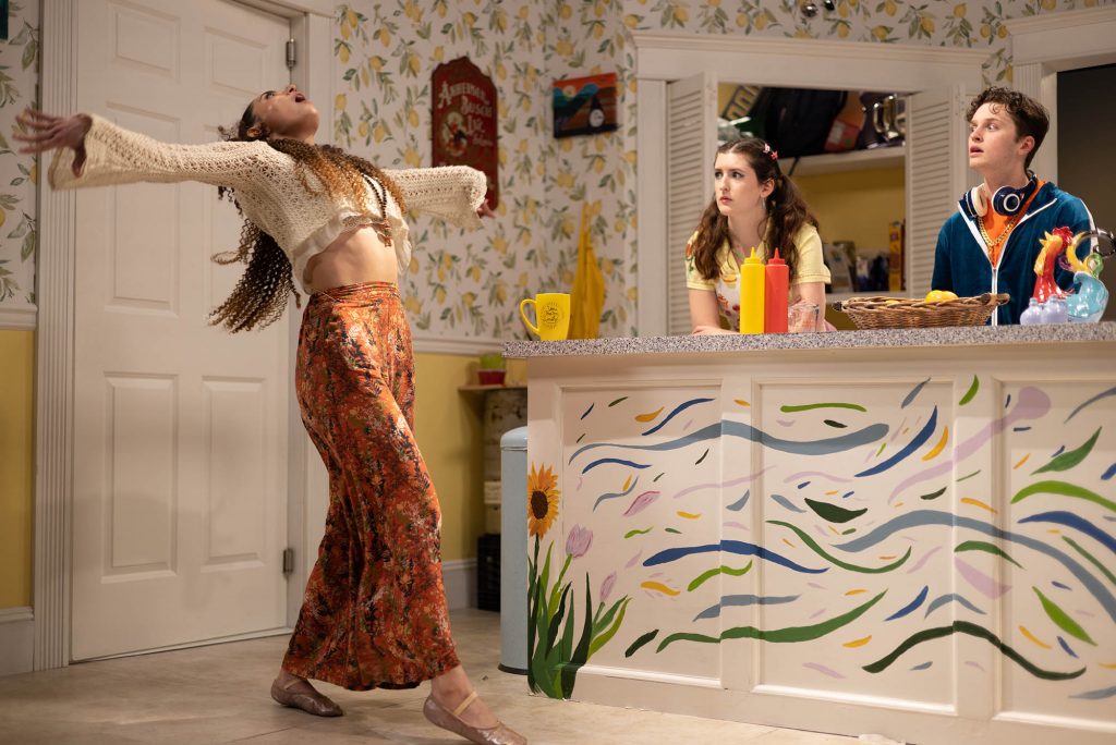 Summer Sage, played by Michaela Lazarou (CFA’24) dancing and Candy Baker, played by Katie McRae (CFA’23), and Lil Bub, played by Aidan Close (CFA’23) watching