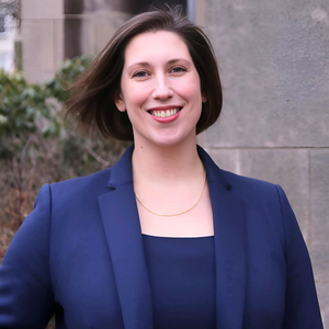 Headshot of Heidi in a blue blazer outdoors