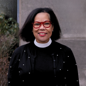 Headshot of Karen in a black sweater outdoors