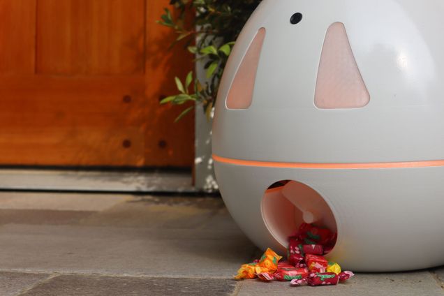 Pumpkin shaped candy dispenser