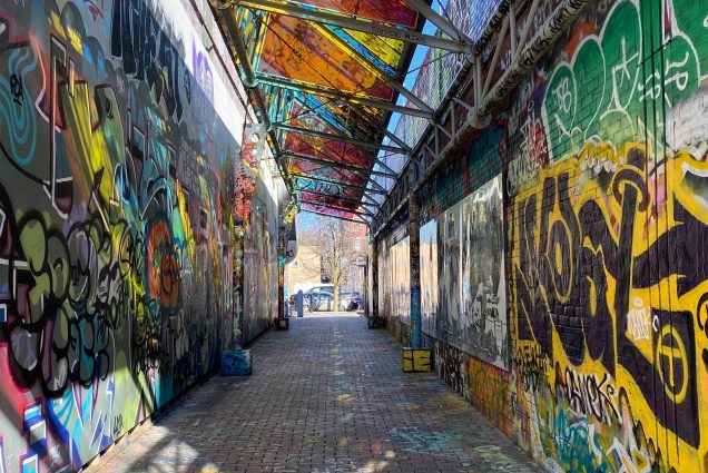 Graffiti Alley, the 80-foot-long walkway covered in graffiti produced by local artists