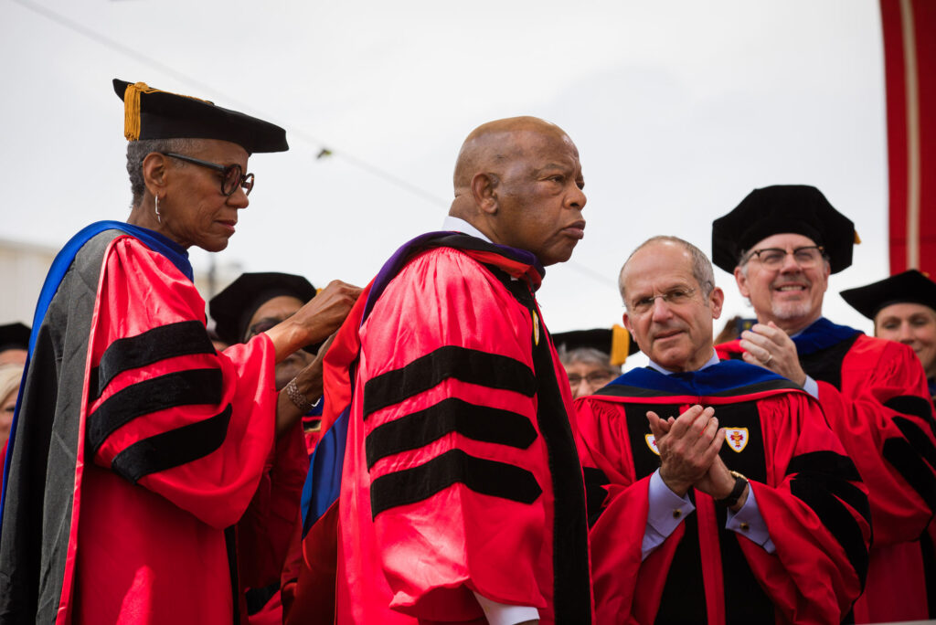 A photo of Andrea Taylor and Congressman John Lewis at BU Commencement
