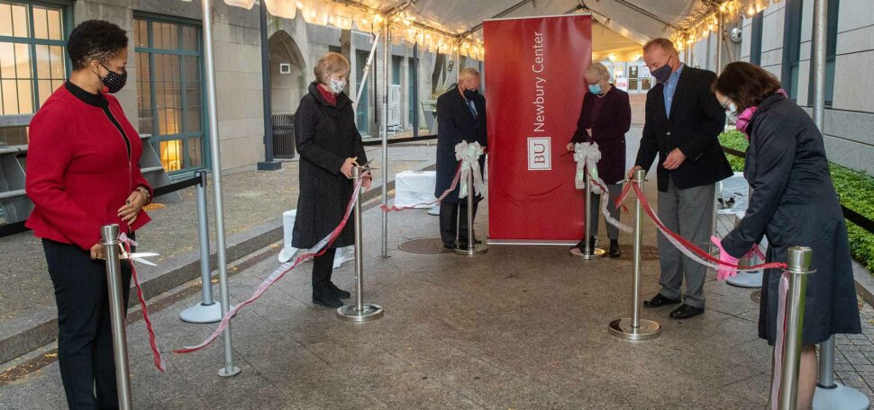 Members of Boston University administration and former trustees of Newbury College cut the ribbon to officially open the Newbury Center at Boston University which will support first generation students