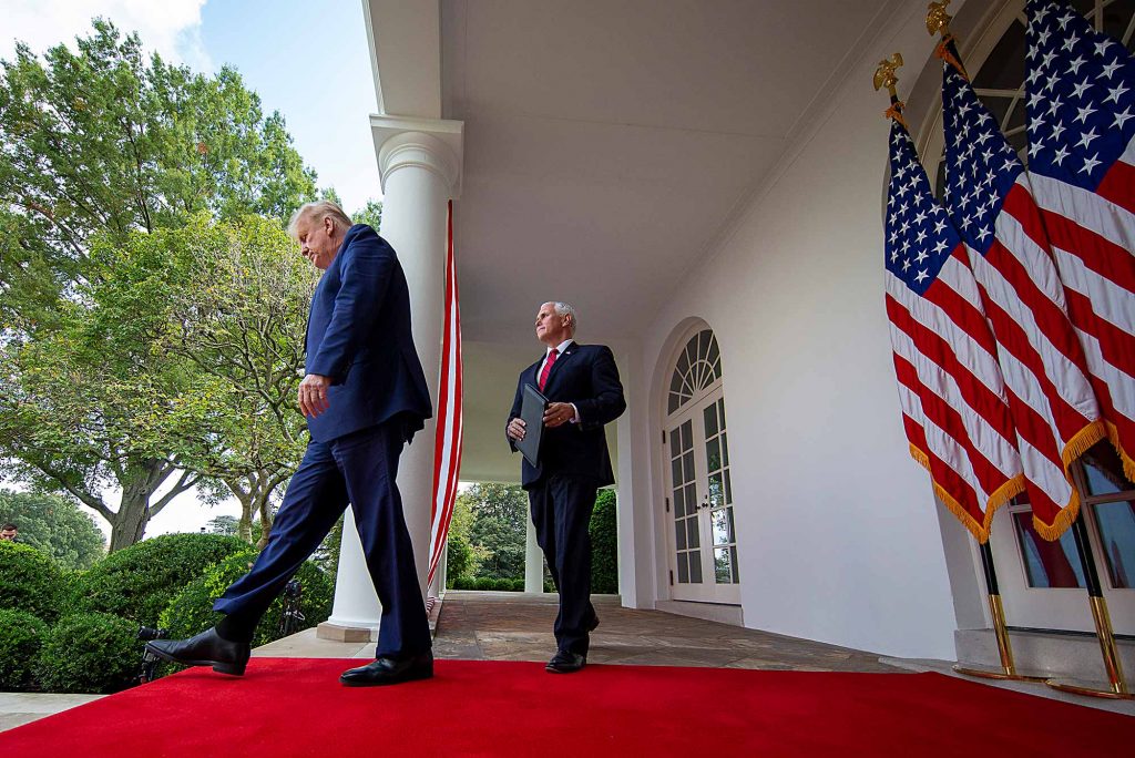 President Trump and Vice President Mike Pence walk out to give a briefing on the nation's coronavirus testing strategy in the Rose Garden of the White House on September 28, 2020.