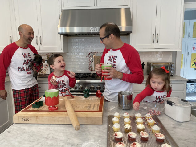 Eric Stine (’97) and his husband, Neil Markman, make cupcakes with their two young children