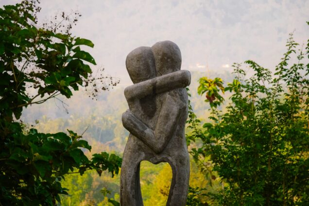 Stone sculpture of two people embracing