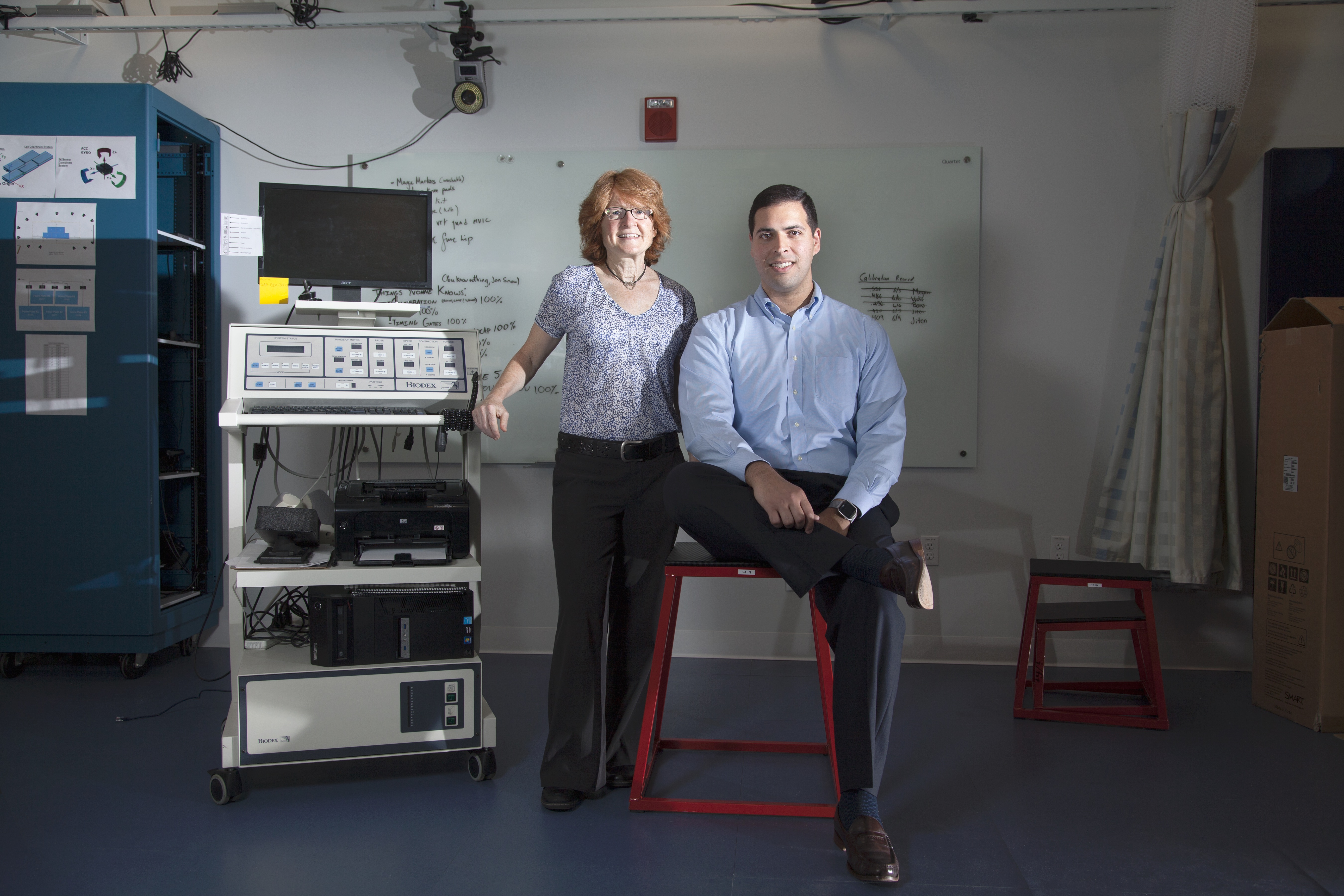 Sargent physical therapy professors Terry Ellis (left) and Lou Awad are developing the medical exosuit to help people relearn to walk after a stroke.