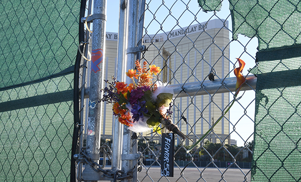 Bouquet of flowers hangs on a chainlink fence in Las Vegas, NV