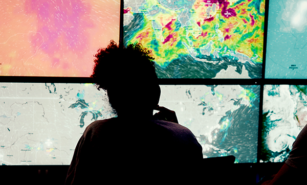 track-storm.-Control-room,-back-or-scientists-with-meteorology-for-broadcast-news,-report-or-climate-change-at-night-600x362