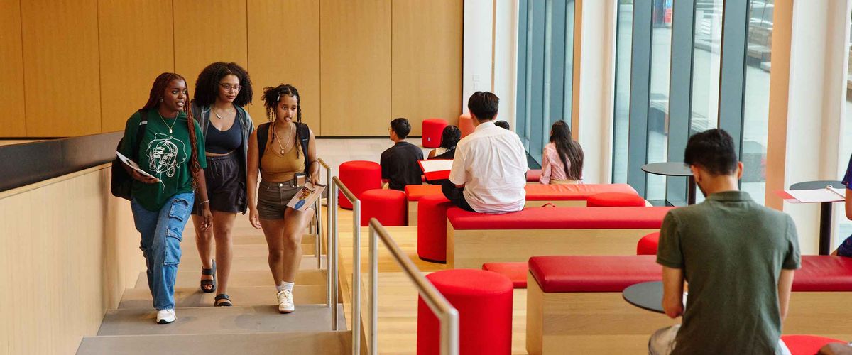Students walking up a staircase inside the BU Center for Computing & Data Sciences
