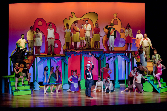 Student actors on colorful Seussical stage