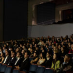 photo: A picture of a crowd seated in a theater