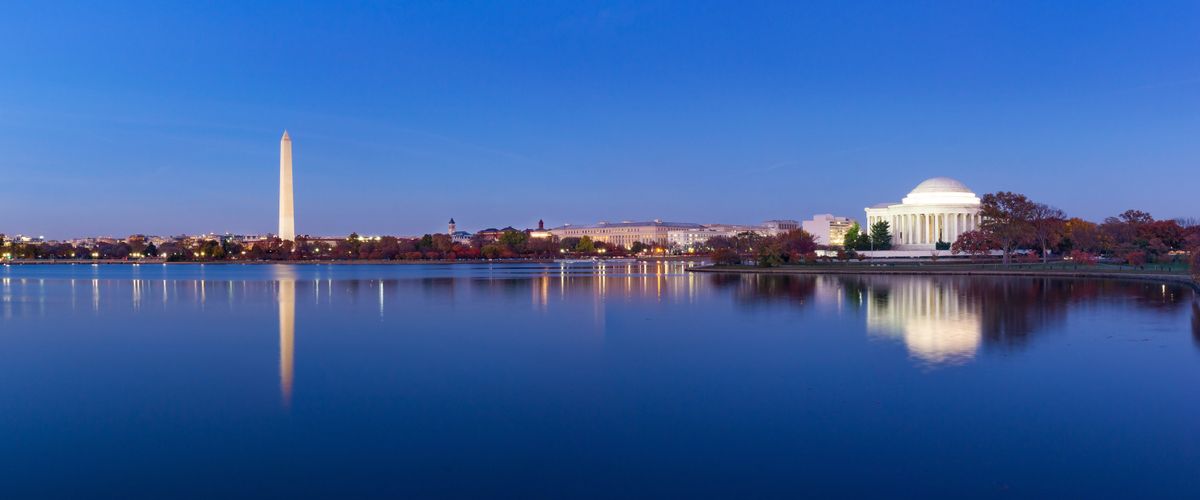 Jeffeerson Memorial and Washington Monument reflected on Tidal Basin in the evening.