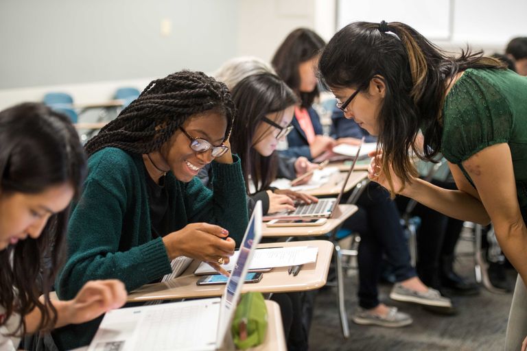 Amber Navarre, at right, works with Deanna Clarke-Campbell (CAS'21), left, during Navarre's Chinese course. For a story about Teaching with Technology conference. Photo by Cydney Scott