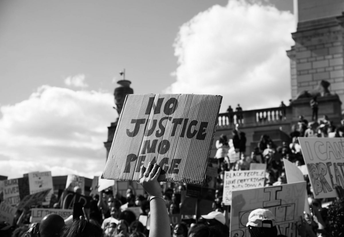 Protestor sign, No Justice No Peace