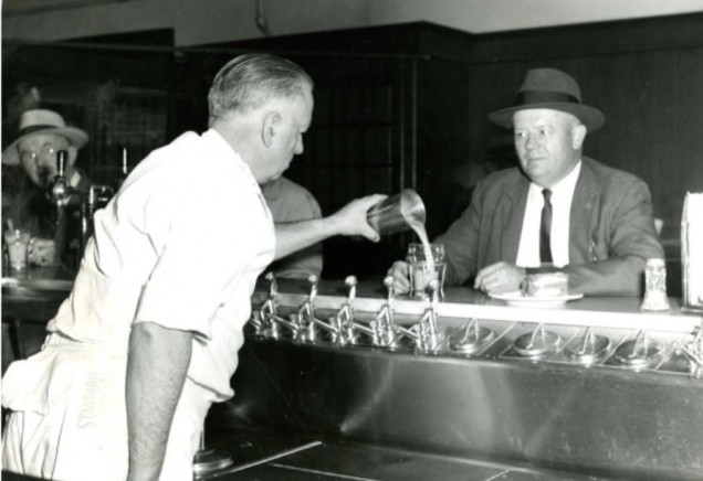 A soda jerk and a customer (1958)