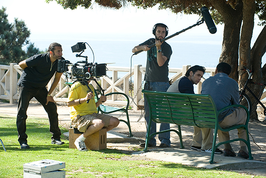 Giovanni Zelko (COM’96) (left) directing Ben Youcef (second from right) in a scene from The Algerian on location in Los Angeles. Photos by Orsoya Tucker