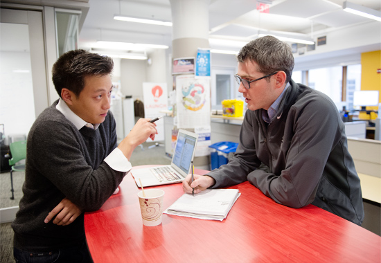 Kelvin Chan (LAW’16) (left) and Nathaniel Gray (LAW’16) are two of the eight BU LAW students working in the Entrepreneurship & Intellectual Property Clinic, a new collaboration between BU and MIT. Photos by Jackie Ricciardi