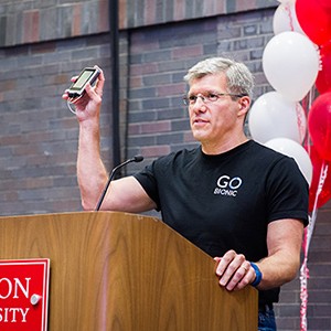 Edward Damiano holds the iLet bionic pancreas while accepting the Innovator of the Year award at the Boston University Tech, Drugs, and Rock n' Roll event