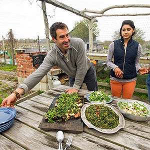 Chris Fischer serves a locally sourced dinner prepared with the help of Boston University Gastronomy students at Beetlebung Farm