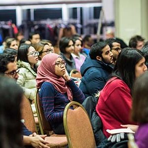 Students, faculty and staff watch a panel discussion on Donald Trump's Executive Order on Immigration during a Town Hall Meeting at Boston University