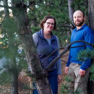 Photo of Lucy Hutyra and Andrew Reinmann in the forest