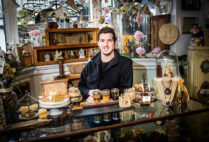 Questrom grad student Brian Woerner is equally at home offering a tasting at Follow the Honey in Cambridge or working with locals in Tanzania to help produce a sustainable supply of organic honey