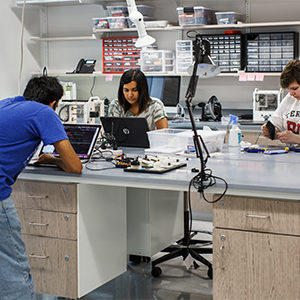 People work in the Design, Automation, Manufacturing, Prototyping lab (DAMP lab) at the Rajen Kilachand Center for Integrated Life Sciences and Engineering science building at Boston University