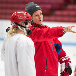 BU Ice Hockey Coach Tara Watchorn instructs a player during practice.