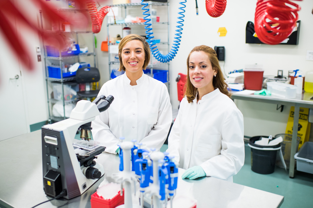 PhD Candidate Whitney Manhart and Research Technician Jennifer Pacheco pose for a photo at the Boston University National Emerging Infectious Diseases Laboratories (NEIDL). They are working with Dr. Elke Muhlberger on LLOV, a filovirus related to Ebola.