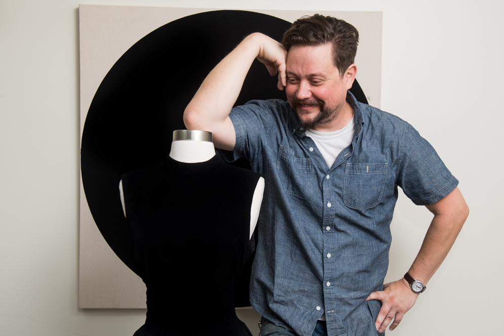 Jason Chase, painter and artist-in-residence at NanoLabs, poses with a black dress painted with Singularity Black paint that will be on display at the Boston Museum of Fine Arts
