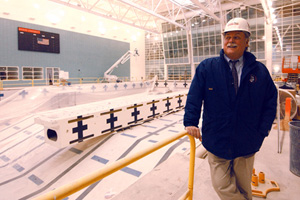 Warin Dexter, director of the department of physical education, recreation, and dance, last year at the Fitness and Recreation Center’s competition pool, when it was still under construction. Photo by Vernon Doucette