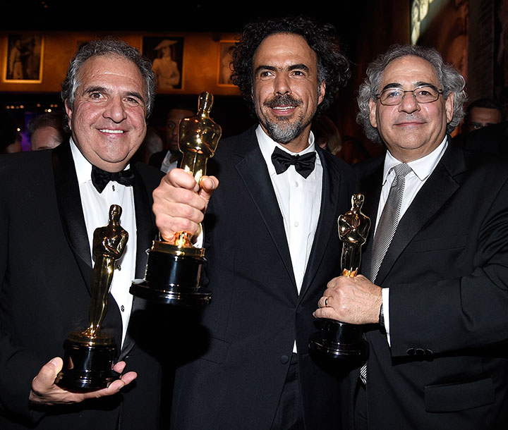 Chairman and Chief Executive Officer of Fox Filmed Entertainment Jim Gianopulos, Director Alejandro Gonzalez Inarritu, winner of Best Original Screenplay, Best Director, and Best Motion Picture, for 'Birdman' Fox Searchlight Co-President Steve Gilula attend the 87th Annual Academy Awards Governors Ball at Hollywood & Highland Center on February 22, 2015 in Hollywood, California