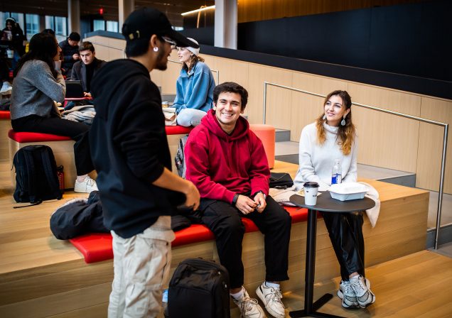 Students interact in an open the collaboration space in the Boston University Center for Computing and Data Sciences vertical campus.